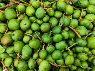 Kilimooku Vadu Mango / Raw Vadu Mangai are baby mangoes generally known as Appe Midi, tender mango. It is specifically used for making vadu mango pickle in a traditional Indian cuisine style.