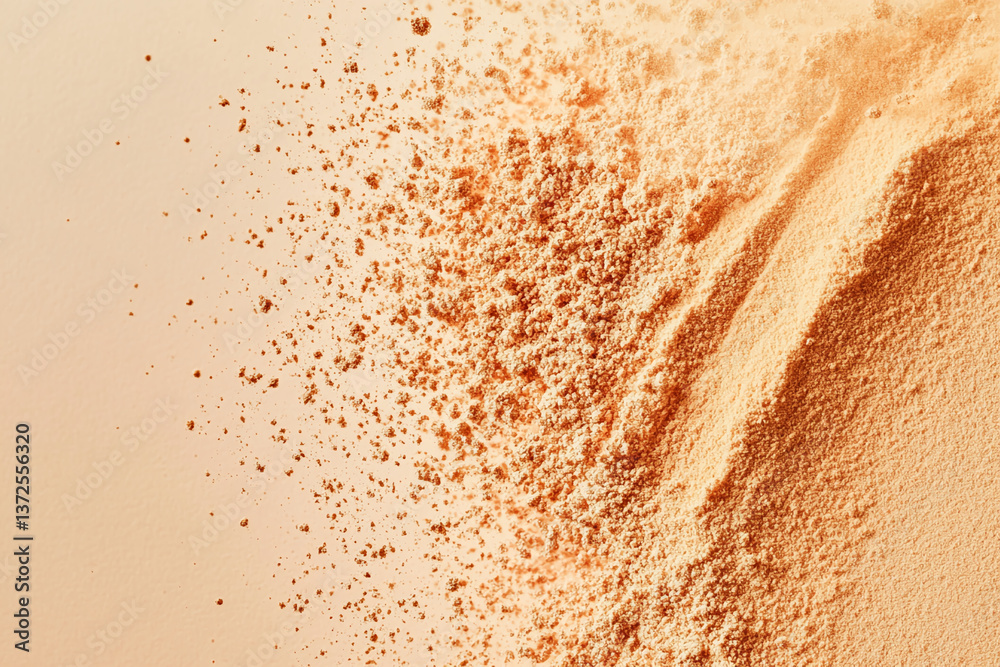 Poster Peach-colored powder texture, scattered and piled, creating a dynamic, abstract design, showcasing a smooth, granular surface ideal for background use