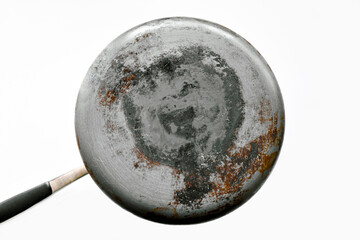 Burnt buttom of saucepan on the table.