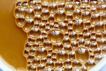 Hot coffee drink texture macro,Coffee foam with bubbles as a background. Top view,Hot coffee bubble...