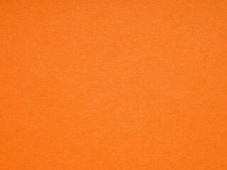 Vivid orange paper texture sparking imagination with a burst of lively color