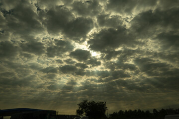 The sunlight through the clouds creates beautiful rays of light.