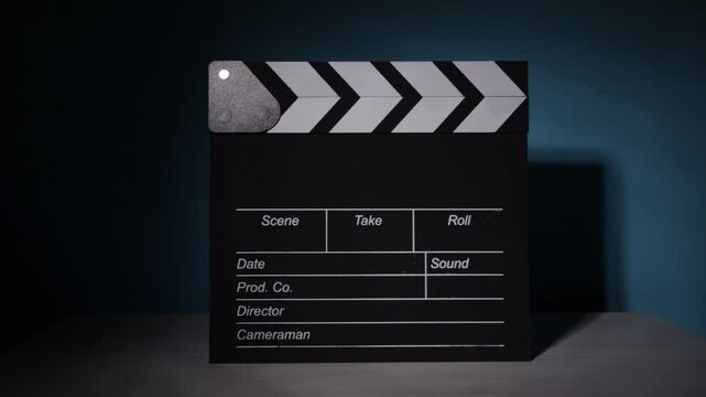 studio lighting, clapperboard slide effect, motion picture industry, cinematic scene, media production, film editing setup, director&rsquo;s perspective, entertainment recording, 
