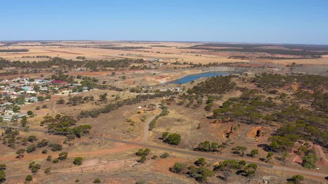 Aerial View over the Town with Larges Waterhole in a Mine, View of the city with gold mine, Video, Western Australia, Australia