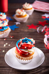 Independence Day Fourth of July USA American patriotic party with american symbols. Cupcakes dessert decorated cream cheese or buttercream.