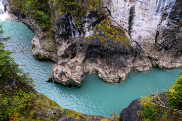 Fototapeta premium Turquoise river Lech flowing through rocky gorge near Füssen, Bavaria, Germany.