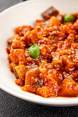 Eggplant stew dish vegetables salad tasty fresh delicious gourmet food background on table rustic food top view copy space keto and paleo diet vegetarian and vegan food