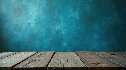 Fototapeta premium Rustic Wooden Tabletop Against a Textured Teal Background, Ideal for Product Displays and Creative Compositions