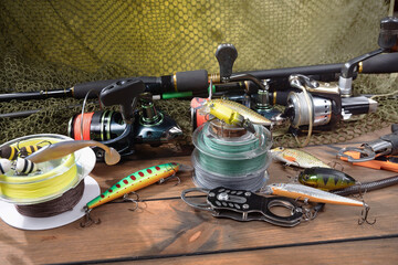 Fishing tackle on the table in a composition.