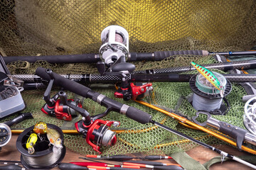 Fishing tackle on a table in a composition with fishing accessories