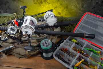 Fishing items laid out on a table against a wooden, old background.