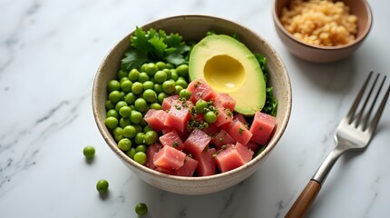 A fresh poke bowl with diced tuna, avocado, and edamame, served in a ceramic bowl on a white marble table. A vibrant and healthy dish.