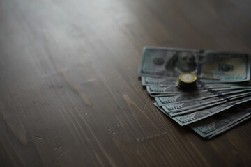 Spread of US Dollar Bills and Euro Coins on Wooden Surface Symbolizing Wealth and Currency Exchange