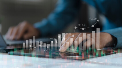 Business concept, Businessman using digital tablet analyzing and calculating financial data,...