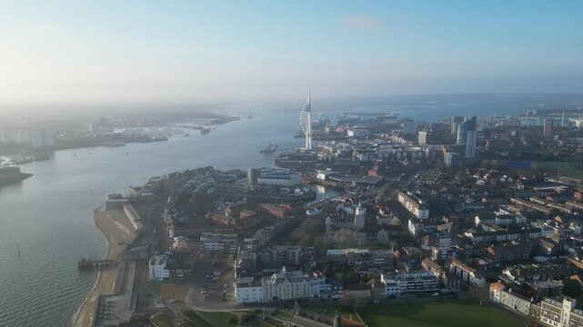 Aerial view of the sail-shaped Spinnaker Tower in Portsmouth Harbor in the south of England on the Channel coast - Gunwharf Quays modern shopping mall in a residential waterfront area