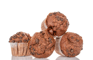 Several chocolate cupcakes, isolated on white background, close-up.