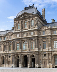 Beautiful, monumental classical architecture building in Paris with large windows.
