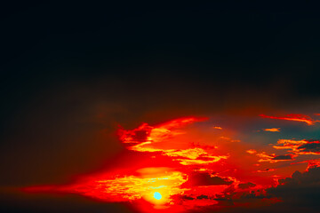 Mesmerizing sunset with sun descending near horizon, bathing sky in warm glow. Dramatic clouds...
