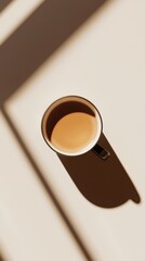 Minimal shadow play with coffee cup top view