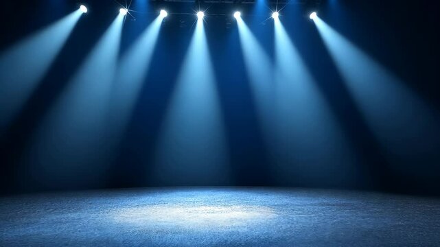 Bright stage lights illuminate an empty performance area in a theater setting, ready for an exciting show to begin