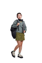 Fototapeta premium Portrait of Asian female student wearing backpack, headphones, fashionable clothes, holding laptop, posing dynamically on white background
