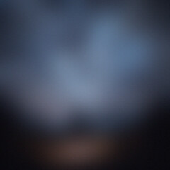 Abstract blurred background with dark tones and color gradients