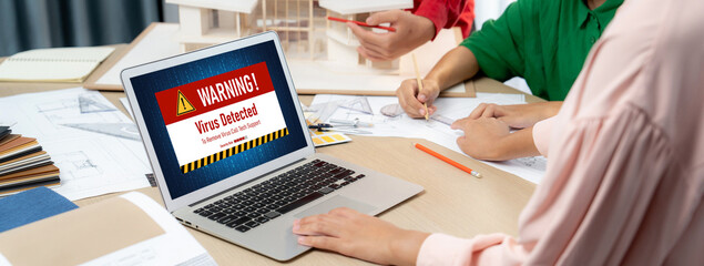 Virus warning alert on computer screen detected brisk cyber threat , hacker, computer virus and...