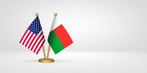 USA vs Madagascar desk flags mockup 3d illustration. Versus flag of US United States of America