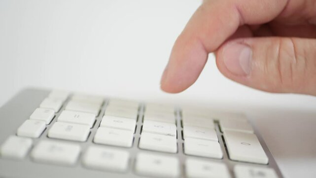 Blurred Shooting with a Businessman in the Office Making Financial Calculations Using a Computer Keypad. An employee in a Financial Corporation Using the PC Keypad. 