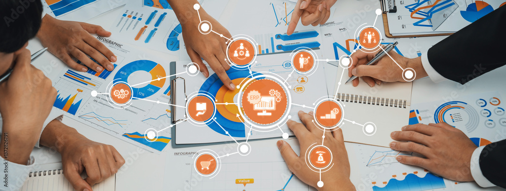 Poster a dynamic workspace showing hands engaged in a collaborative business session with charts and graphs