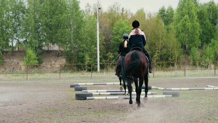 A Young Equestrian Enthusiast Riding a Beautiful Brown Horse in an Expansive Outdoor Arena