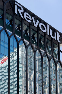 LONDON, UK - MARCH 26, 2025:  Exterior view of Revolut HQ in the YY building at Canary Wharf with sign
