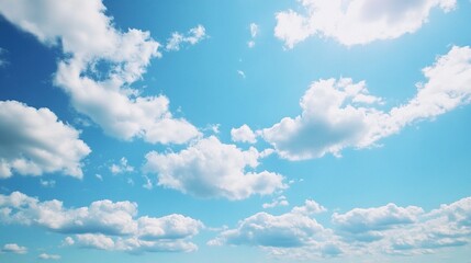 Clear blue sky with fluffy white clouds