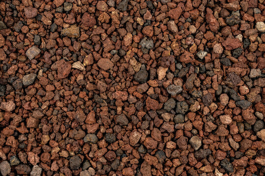 Close-up background texture of pic&oacute;n, lapilli, and reddish volcanic stones
