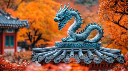 Fototapeta premium A blue dragon statue on top of a building in a park