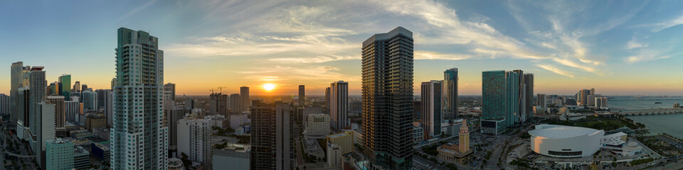 Fototapeta premium Aerial view of downtown office district of Miami Brickell in Florida, USA at sunset. High commercial and residential skyscraper buildings in modern american megapolis
