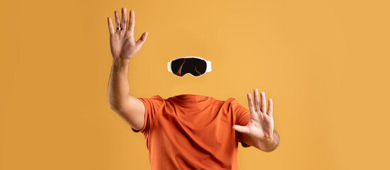 A user enthusiastically engages with virtual reality technology while wearing goggles, showcasing a...