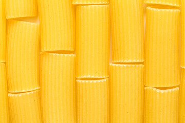 Rigatoni, tube shaped dry pasta with ridges, isolated on white background 