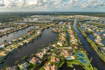 Flooded residential area with underwater houses from hurricane rainfall water in Florida suburban community. Aftermath of natural disaster in southern USA