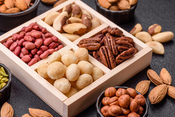 Wooden box with macadamia nuts, Brazil nuts, pecans and peanuts