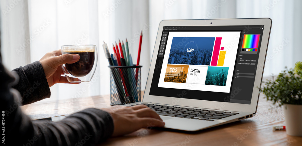 Fototapete graphic designer software for modern design of web page and commercial ads showing on the computer s