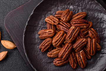 Nut, pecans in a ceramic bowl, an ingredient in vegan food