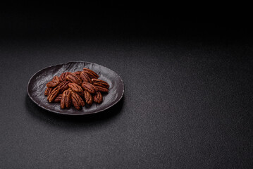 Nut, pecans in a ceramic bowl, an ingredient in vegan food