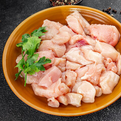 Chicken raw meat pieces of meat poultry tasty fresh delicious gourmet food background on table rustic food top view copy space keto and paleo diet