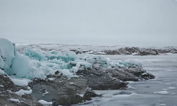 Winter landscape with snow covered rocks at Arctic Ocean