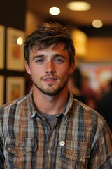 Obraz premium Handsome man with a plaid shirt looking.