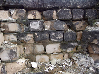 Crumbling Brick Wall Texture: Aged Stone and Mortar, Rustic Industrial Background, Damaged Historical Surface, Worn Detail 