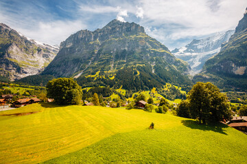 Aerial view of Grindelwald village among high mountains. Location place Bernese Alps, Interlaken...