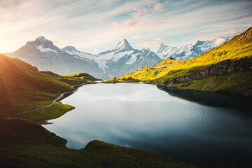 Fantastic view of high-altitude lake Bachalpsee and snowy rocky massif. Location place Bernese Alps, Grindelwald valley, Europe.