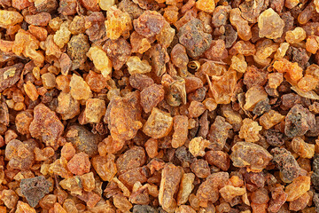 Aromatic yellow gum resin as background, top view. Myrrh, fragrances, Sudanese Frankincense tree....